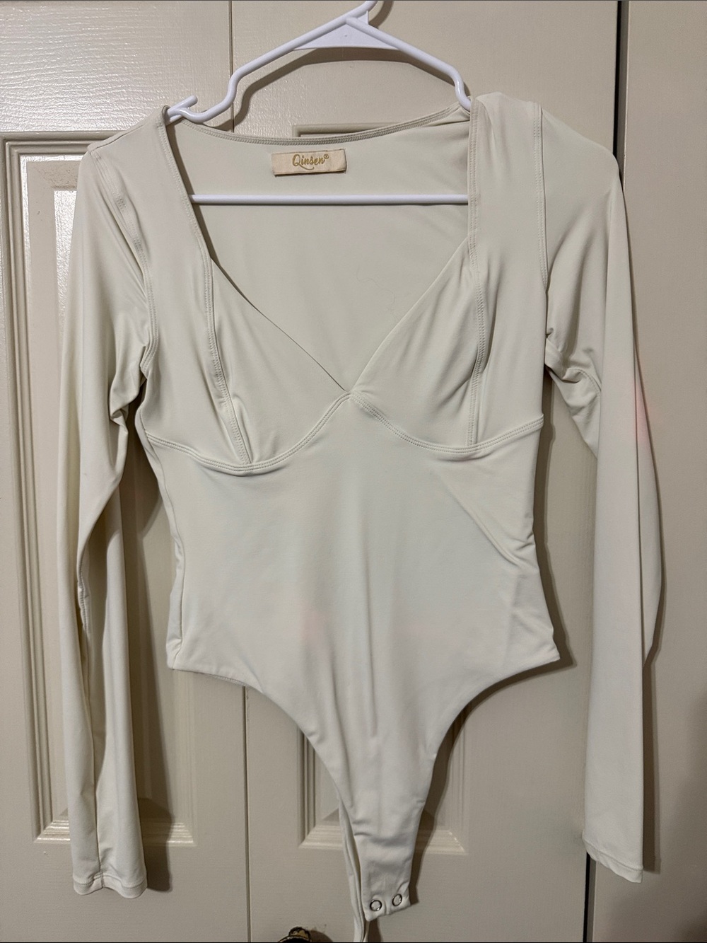 Cutout Long Sleeve Bodysuit in Cream by Zaiden